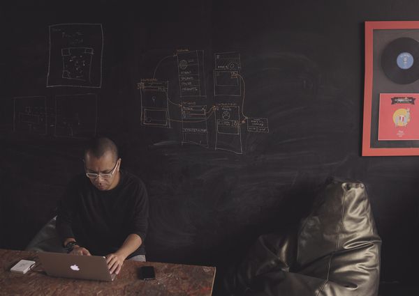 Men working on computer