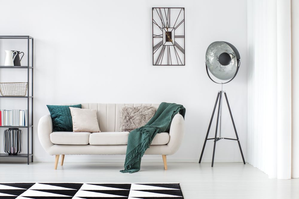 white couch with colourful accessories