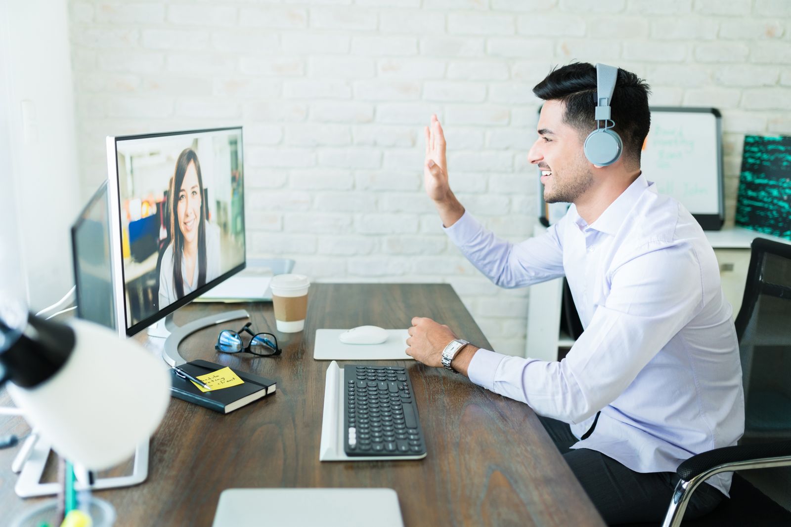 Man videoconferencing with a colleague