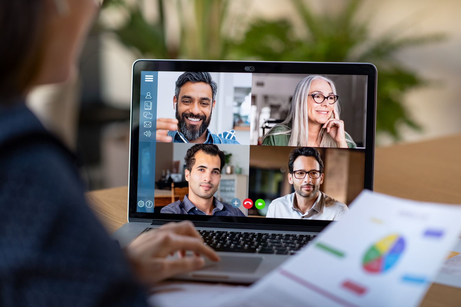 Colleagues videoconferencing as they work from home