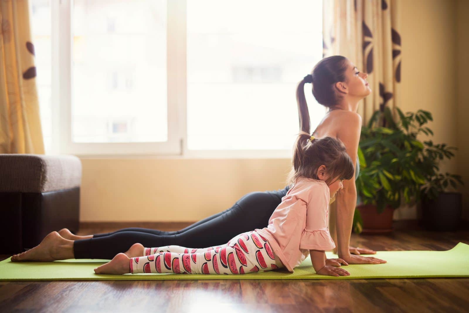 Mother and daughter doing yoga