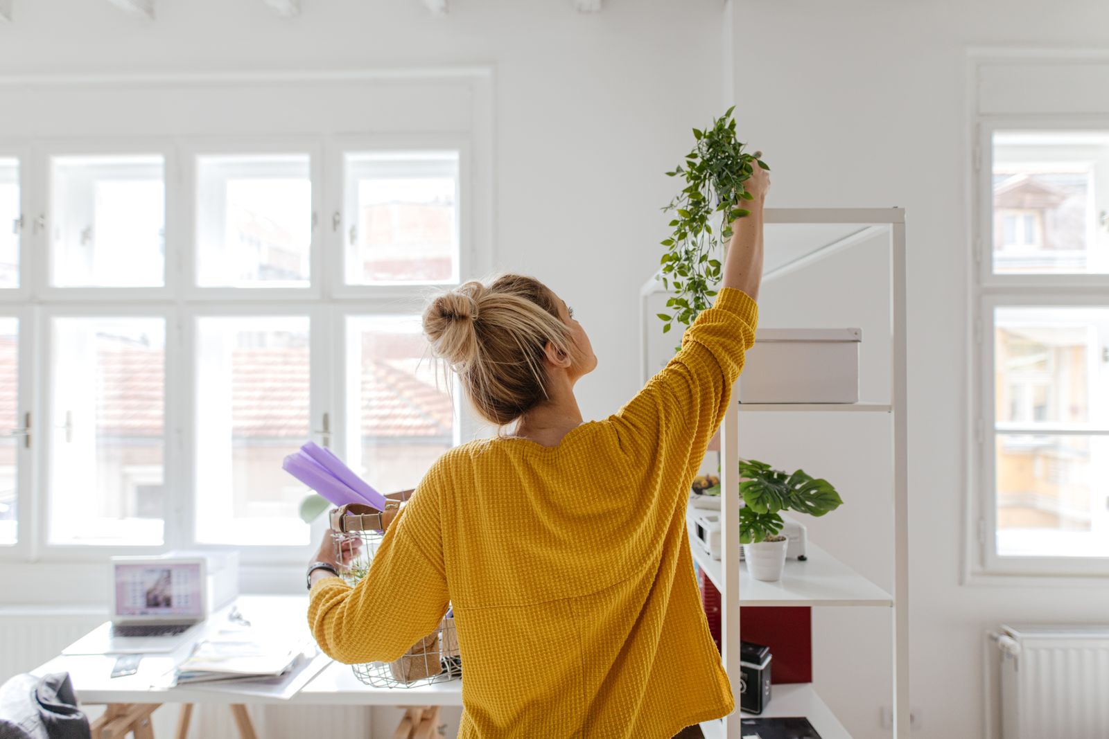 Woman decorating her home office