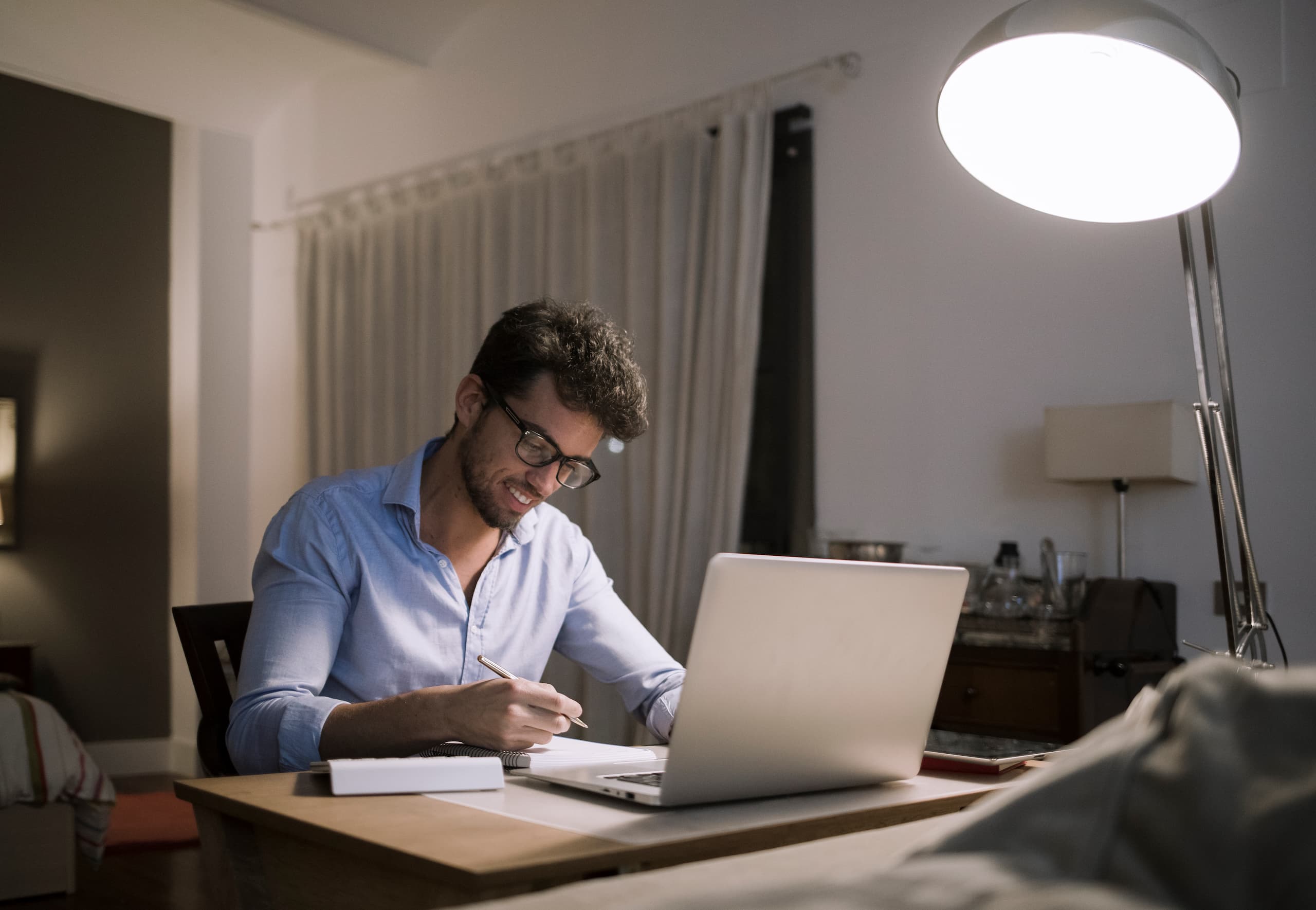 Man happily working at his desk