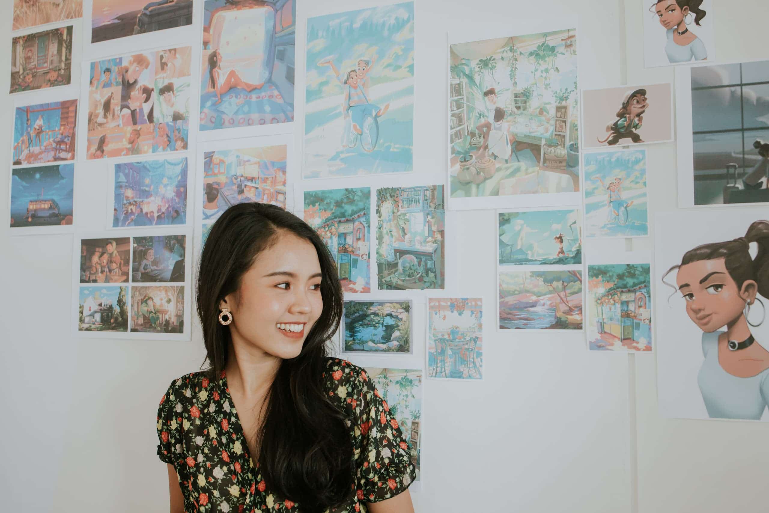 Woman in front of a wall with art