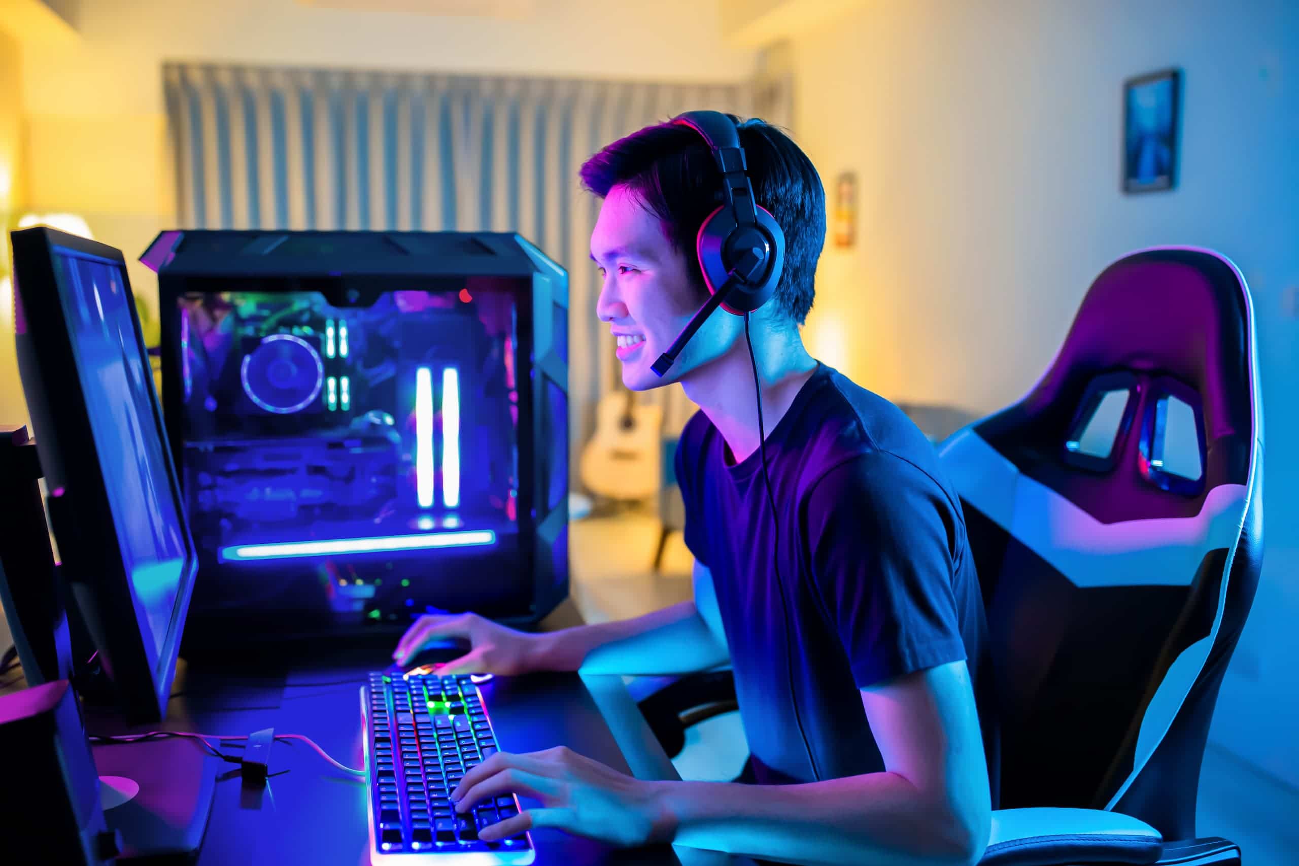 Young man gaming with cool lighting