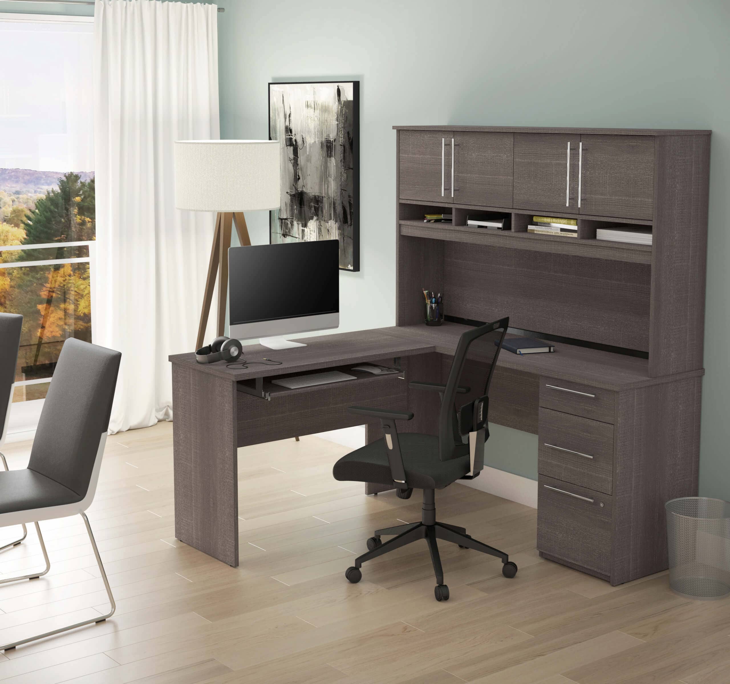 Home office with a Bestar L shaped desk with hutch