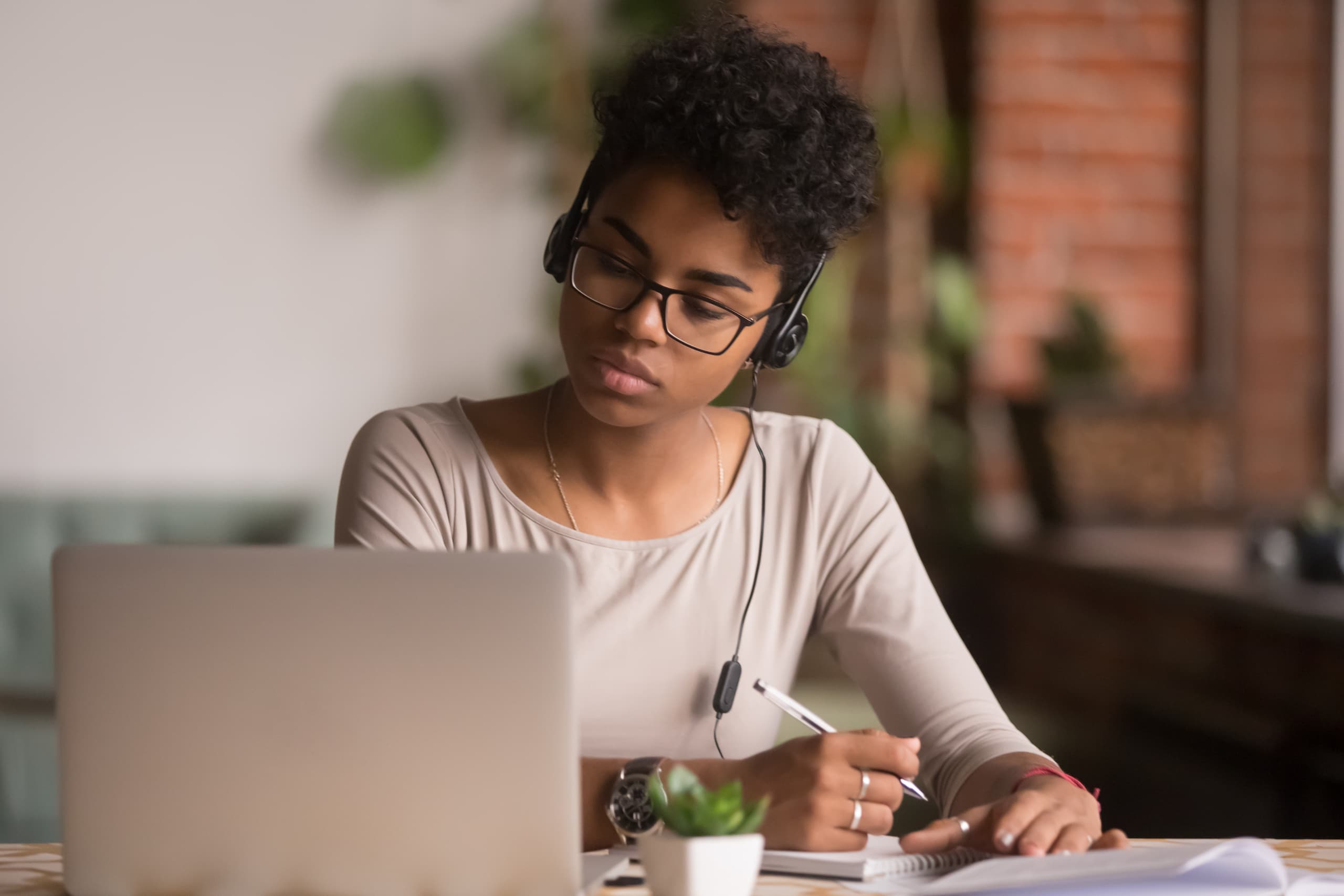 Young woman avoiding distractions while working from home